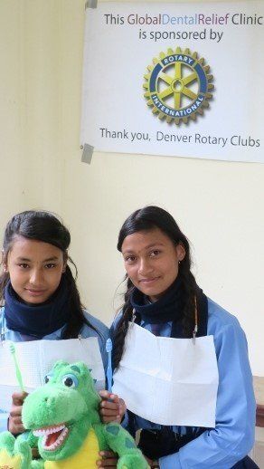 Girls in Global Dental Relief clinic, receiving information about dental care