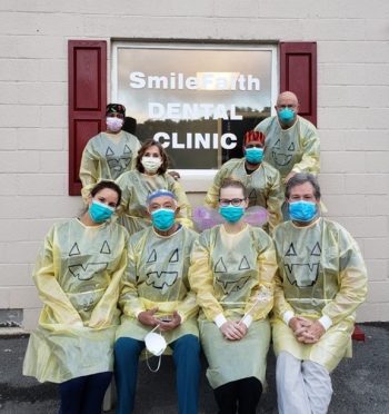 group of dental volunteers wearing protective equipment